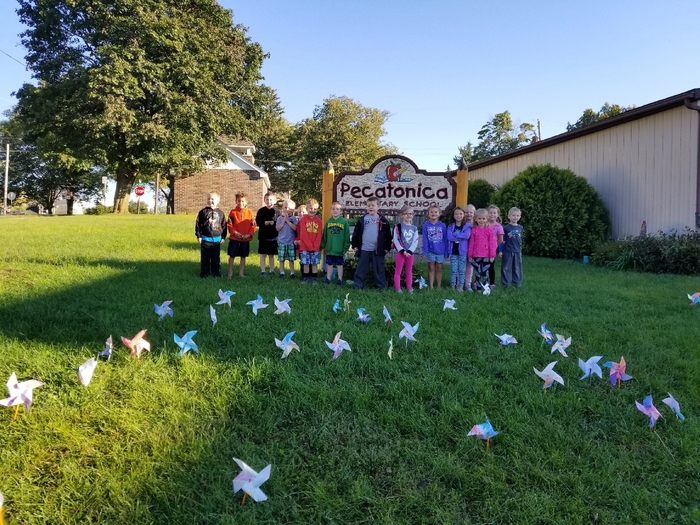Mrs. Laue's class after planting Pinwheels for Peace this morning! 